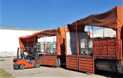 Lithium brines being unloaded at port into containers for shipping.