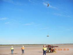 Figure 4. Support pontoon being lowered into position by the helicopter