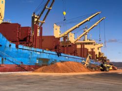 Early loading – note Plimsoll line on ship