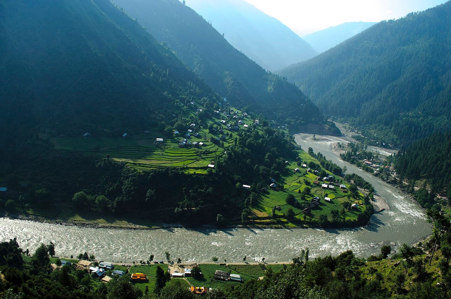 The Neelum River curving past terraced fields at Keran