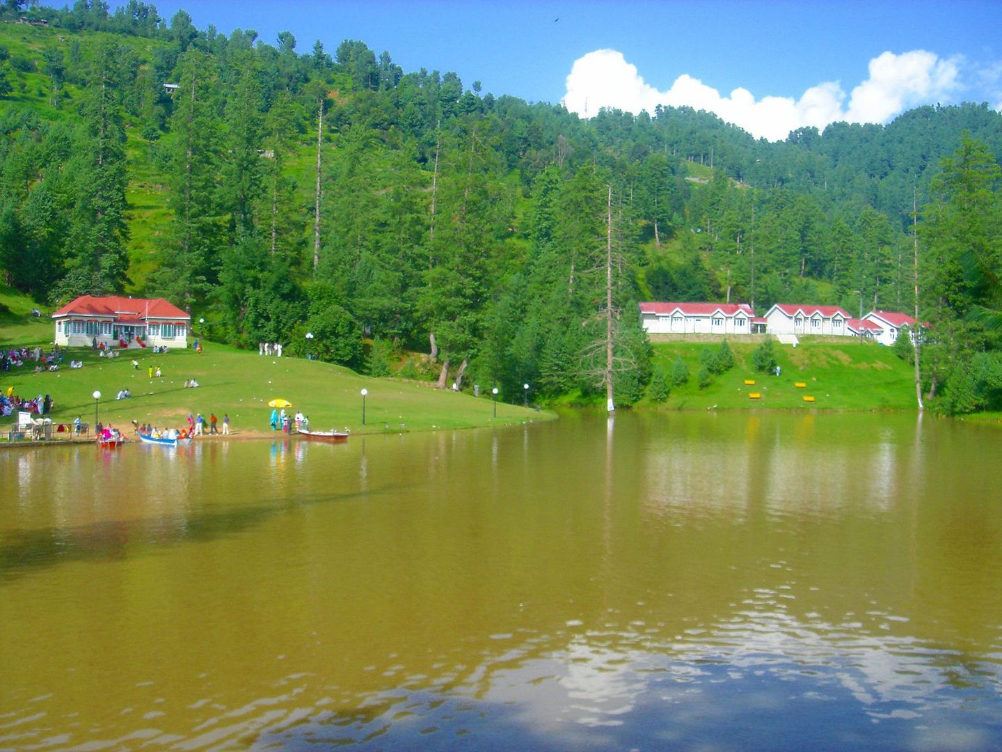 Banjosa Lake, with red-roofed buildings among the pines