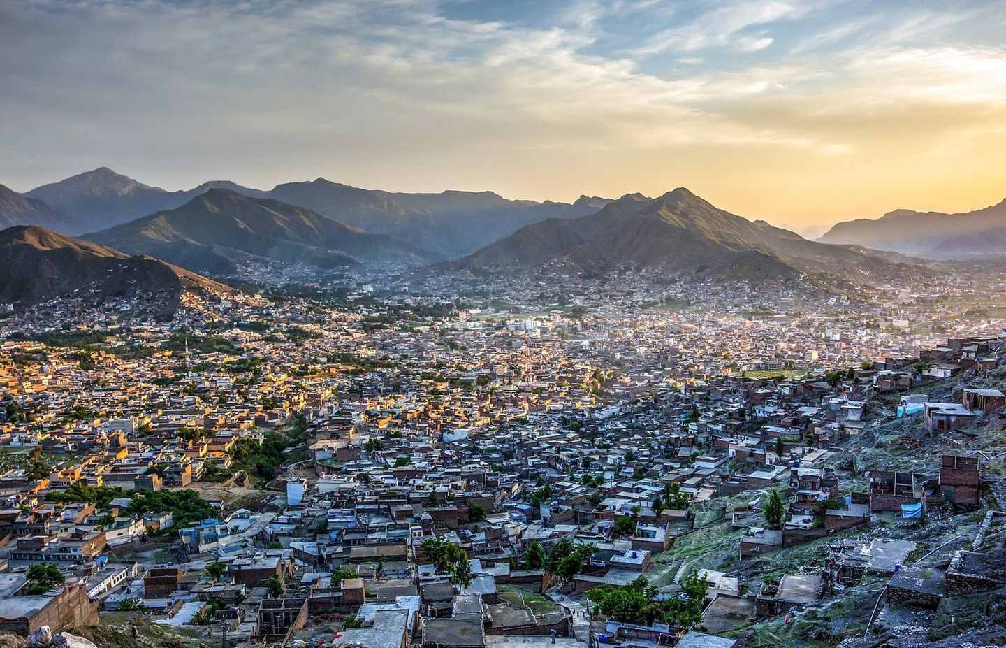 Mingora’s rooftops at sunset below the hills of the Swat Valley