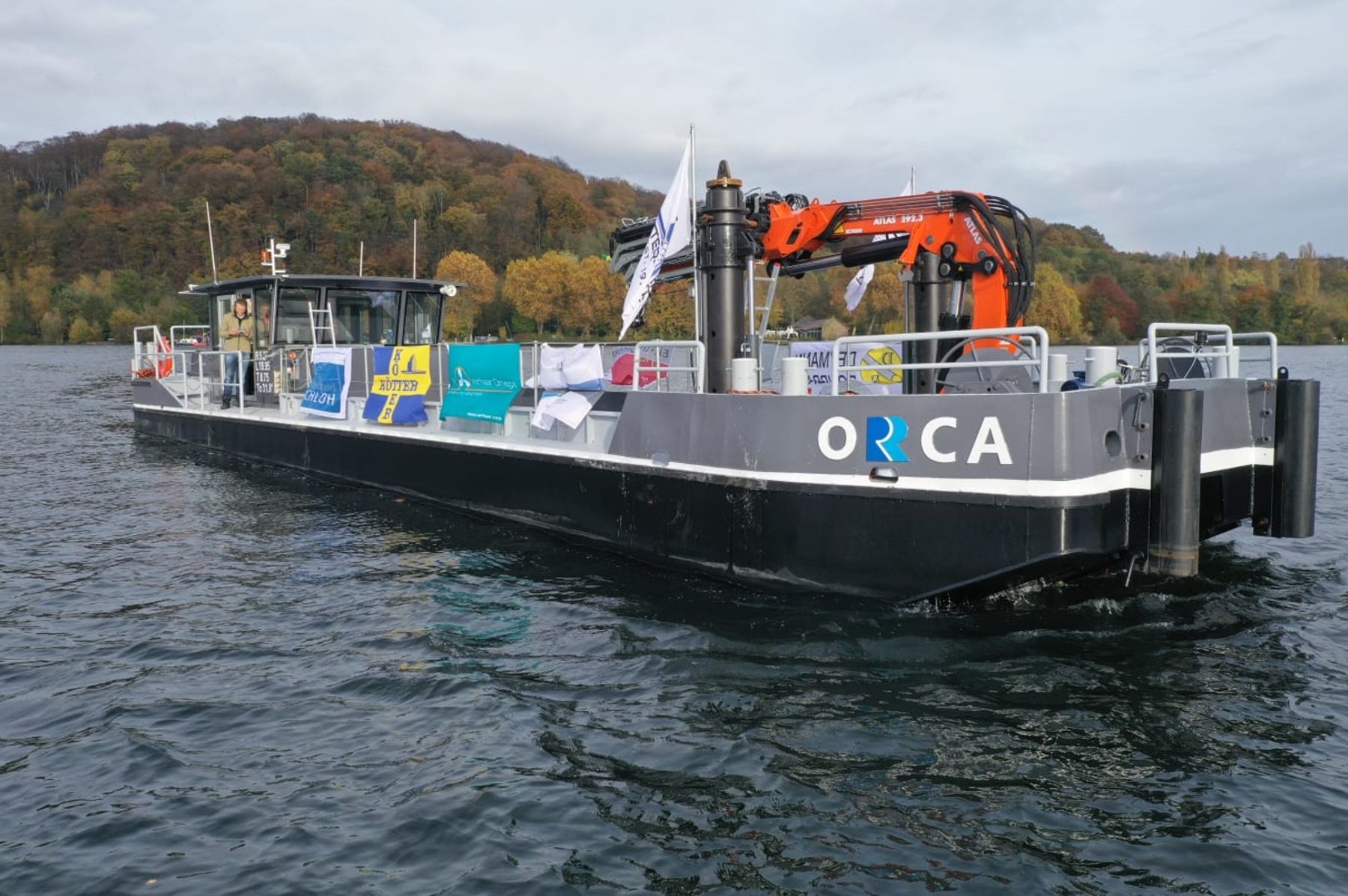 Workboat with crane and spuds