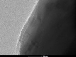 Figure 2 – Electron Microscope images of alumina coated graphite particles