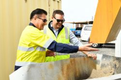 Figure 2: Jacob and James examining screen hopper overflow during Gekko commissioning.