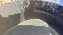 Photograph 1: PTORC024 156-157m panned visible gold