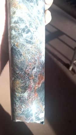 Figure 3: Hole 21NDMT001: 148.2m to 148.4m showing native copper, covellite, chalcopyrite and chalcocite