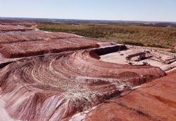 Figure 2. Stacker laying down Anthill ore on Pad 8