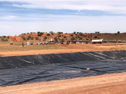 Installed pond liner with Vali-1 well site and laydown area 