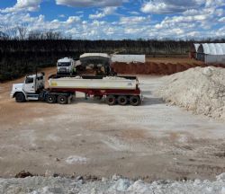 Figure 1: First load of ore being loaded onto 2 trucks at Bulk Sample pit site