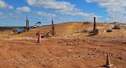 Figure 2: Grade Control (blue rig), blast hole drilling and loading first shot (23 August 2024)