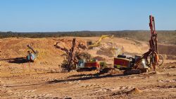 Figure 4: Drilling second shot with load and haul operations in background (27 August 2024)