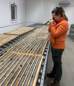 Figure 6b: Basin geologist and exploration manager recording key structural details on core