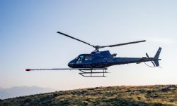 Figure 1; Photo of Eurocopter AS-350 B3 with magnetometer probe being utilised