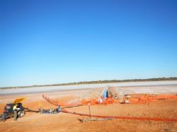 Pump test in progress and discharge pipe at Pulcura Lake Trench.