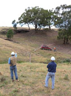 Figure 3 - Dr. Vladimir David indicates the azimuth direction for Hole #2 toward the historic Colossal Reef copper mine