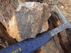 riable tin grades in sheared volcanic rocks at Black Rock prospect