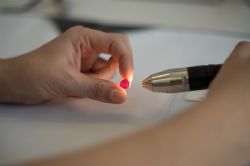 Buyer inspecting a ruby at Mustang’s inaugural rough ruby tender