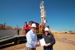 Phil Staveley, CEO of LCK with Viv Oldfield, Director of Silver City Drilling and a copy of the contract between the two South Australian based companies.