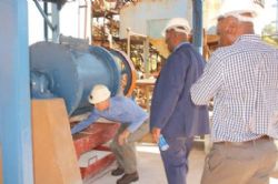 The Honourable Minister viewing Prospect's lithium carbonate pilot plant with General Manager Lee John and Examix Director Paul Chimbodza
