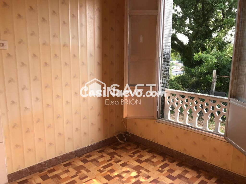 Casa adosada con huerta.