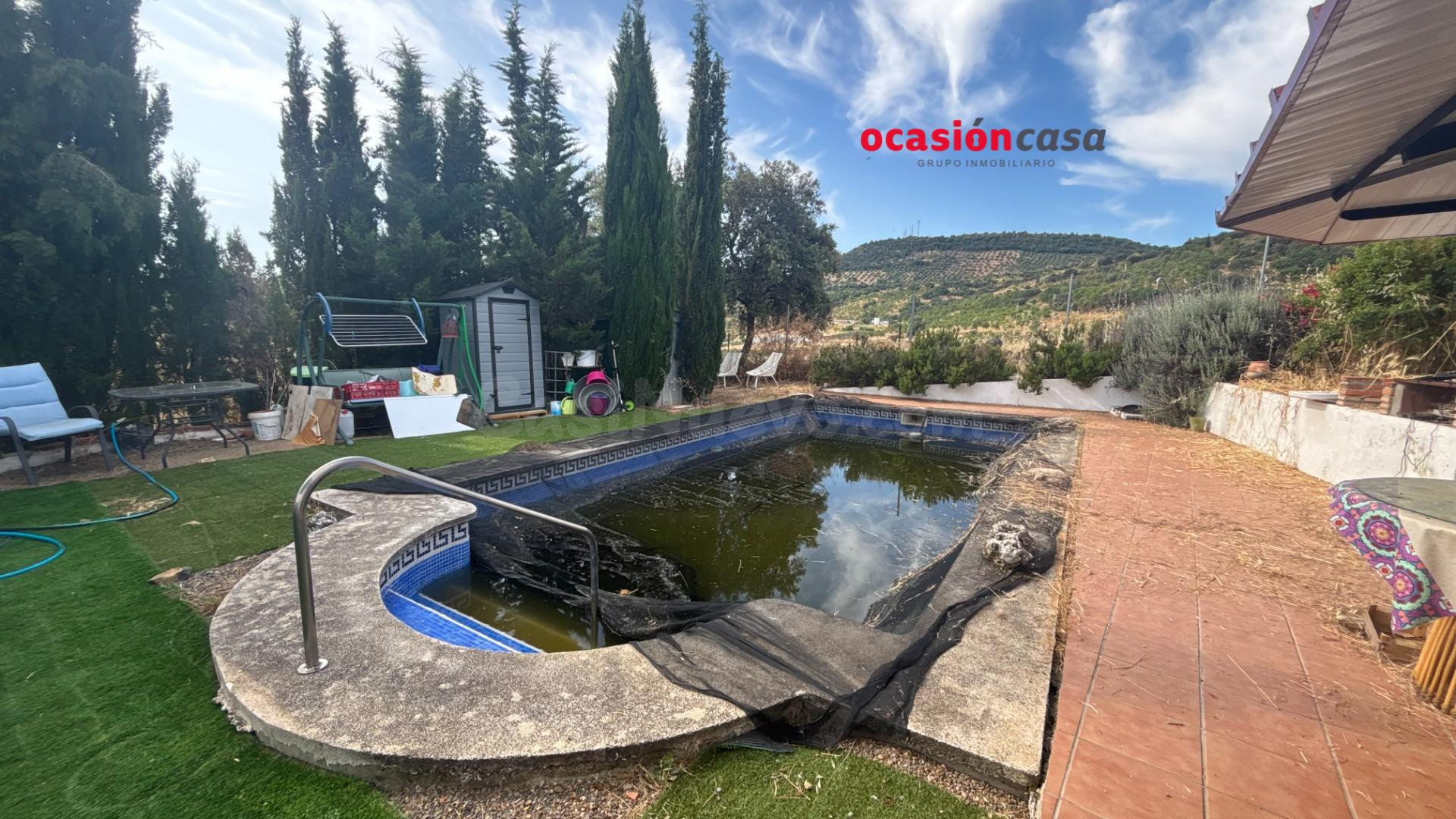 PARCELA CON VIVIENDA Y PISCINA A LA VENTA