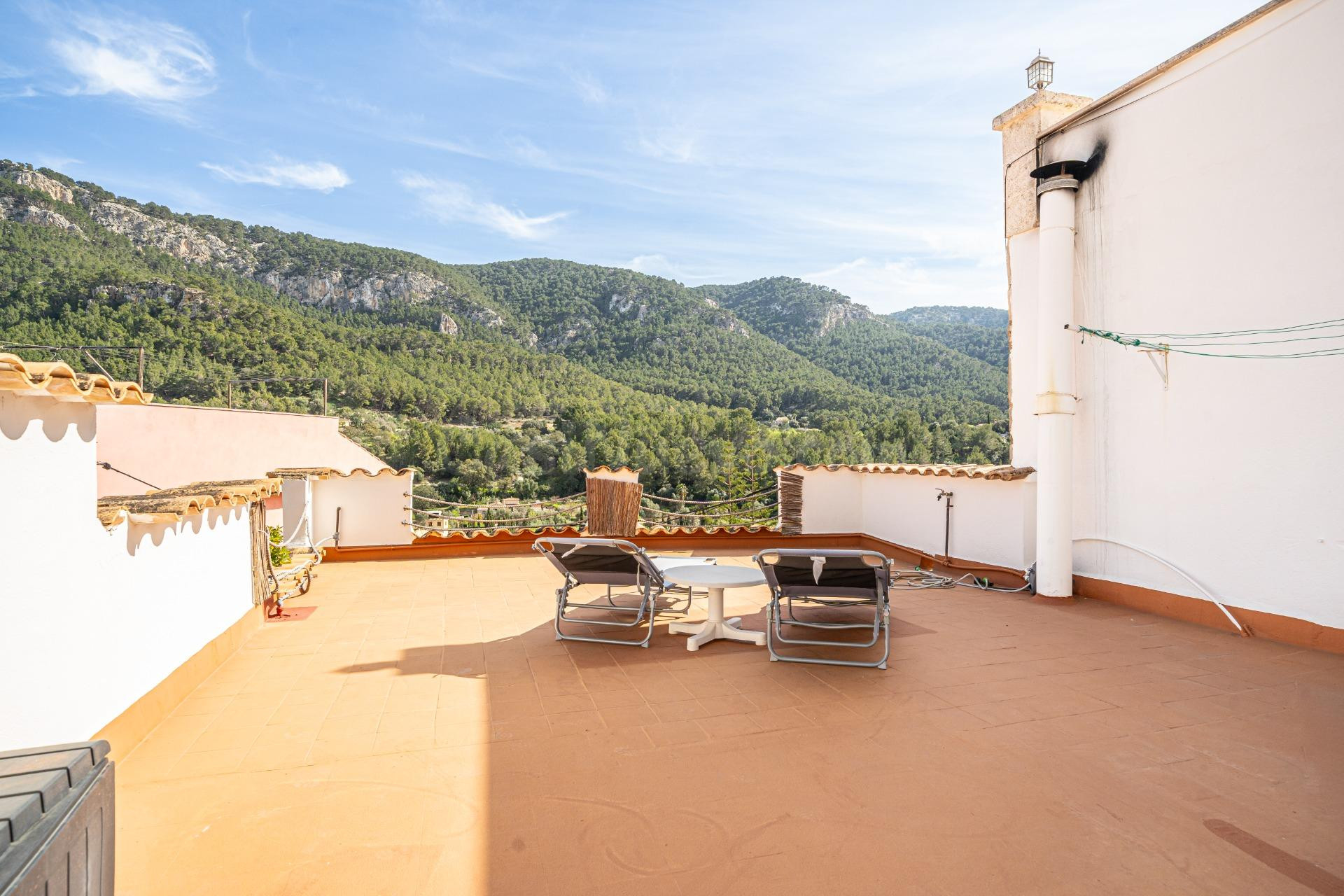 Casa adosada con gran terraza y vistas a la montaña en Sa Co