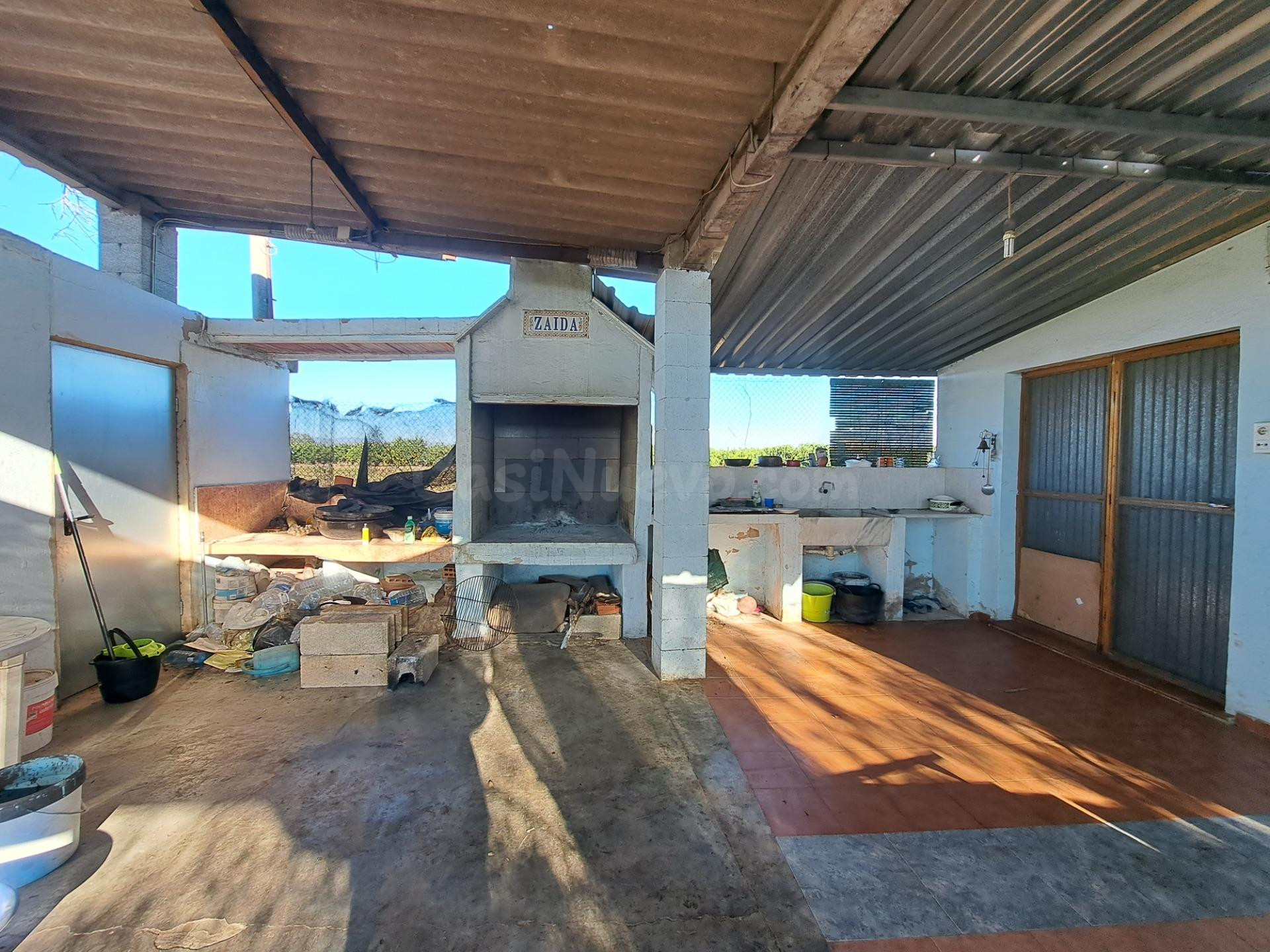 ESTUPENDO TERRENO CON VIVIENDA CERCANO AL PUEBLO