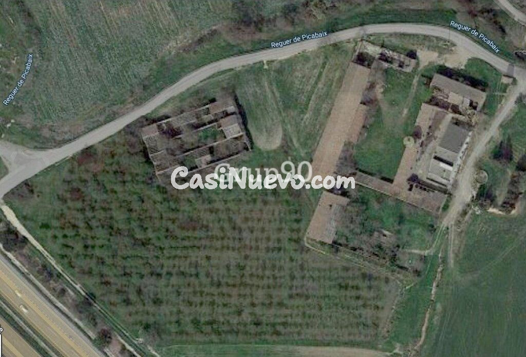 GRAN PARCELA CON INMUEBLES DIVERSOS EN LLIVIA IDEAL PARA RESTAURANTE CON GASOLINERA