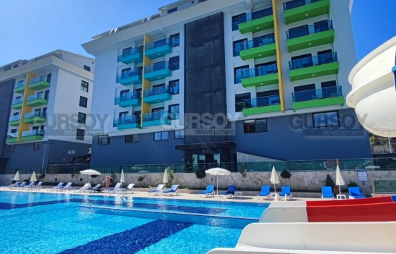 Апартаменты 1+1 в элитном комплексе в районе Каргыджак, 50м2 в Турции - фото 2