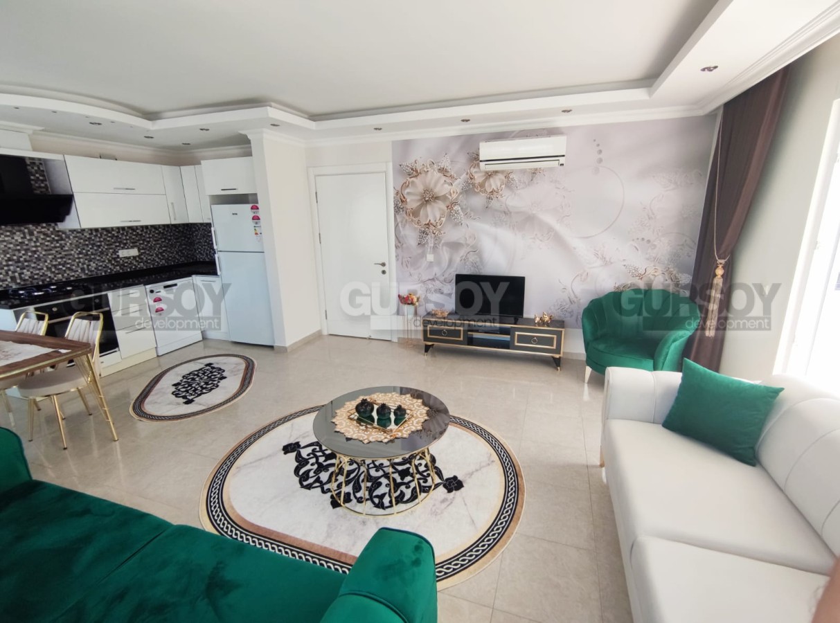 Шикарная просторная квартира 1+1 с видом на горы всего в 350 м от моря в Махмутларе, 70 м2 в Турции - фото 1
