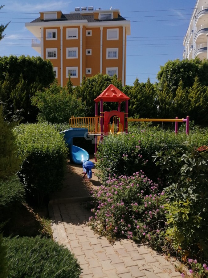 Просторная квартира 1+1 в комплексе с бассейном в центре Авсаллара, 75 м2 в Турции - фото 1
