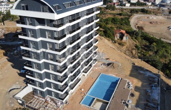 Две новые квартиры 1+1 с видом на море в современном комплексе в Демирташе, 50 м2 в Турции - фото 4