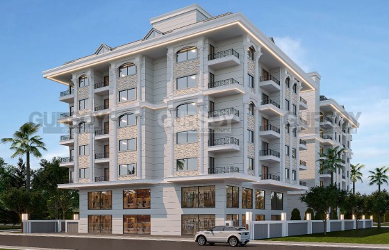 Новый строящийся проект в центре Махмутлара в 100 метрах от моря, 54 м2-120м2 в Турции - фото 1