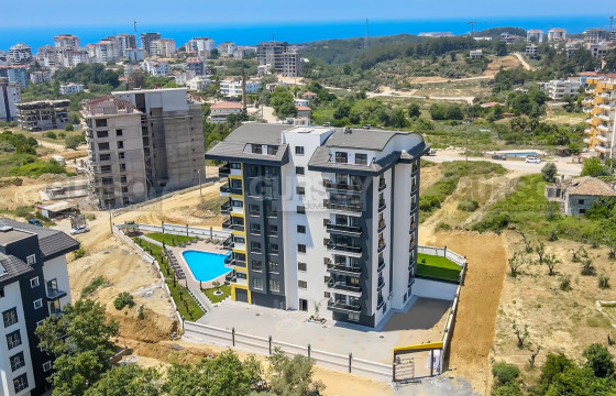 Две квартиры 1+1 в новом комплексе в районе Авсаллар, 64 м2 в Турции - фото 4