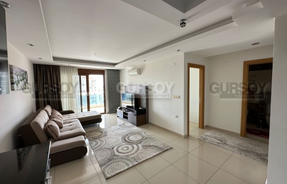 Просторная меблированная квартира 1+1 с видом на море в элитном ЖК в ДЖикджилли, 75 м2 в Турции - фото 1