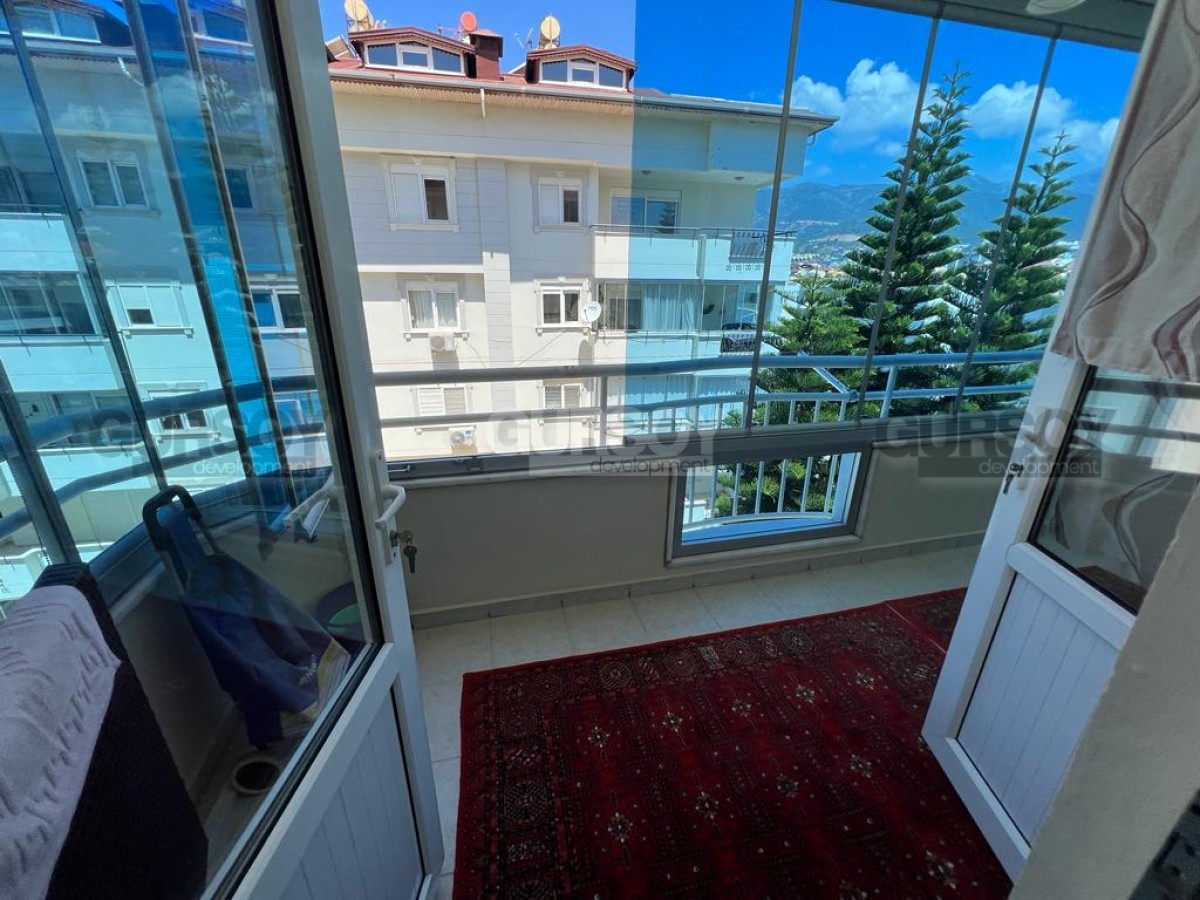 Меблированная квартира 1+1 с красивым видом на горы всего в 200 м от пляжа в районе Оба, 45 м2 в Турции - фото 1