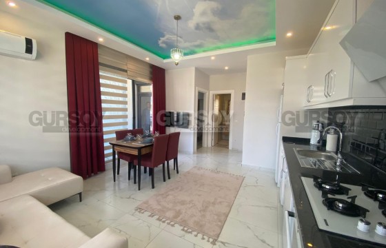 Небольшая новая квартира с мебелью и бытовой техникой, на 4-м этаже, в 1300 метрах от моря в Турции - фото 11