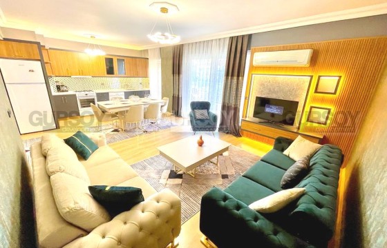 Квартира 2+1 с современным дизайном, мебелью и бытовой техникой, на 3-м этаже, в 150 метрах от моря в Турции - фото 1