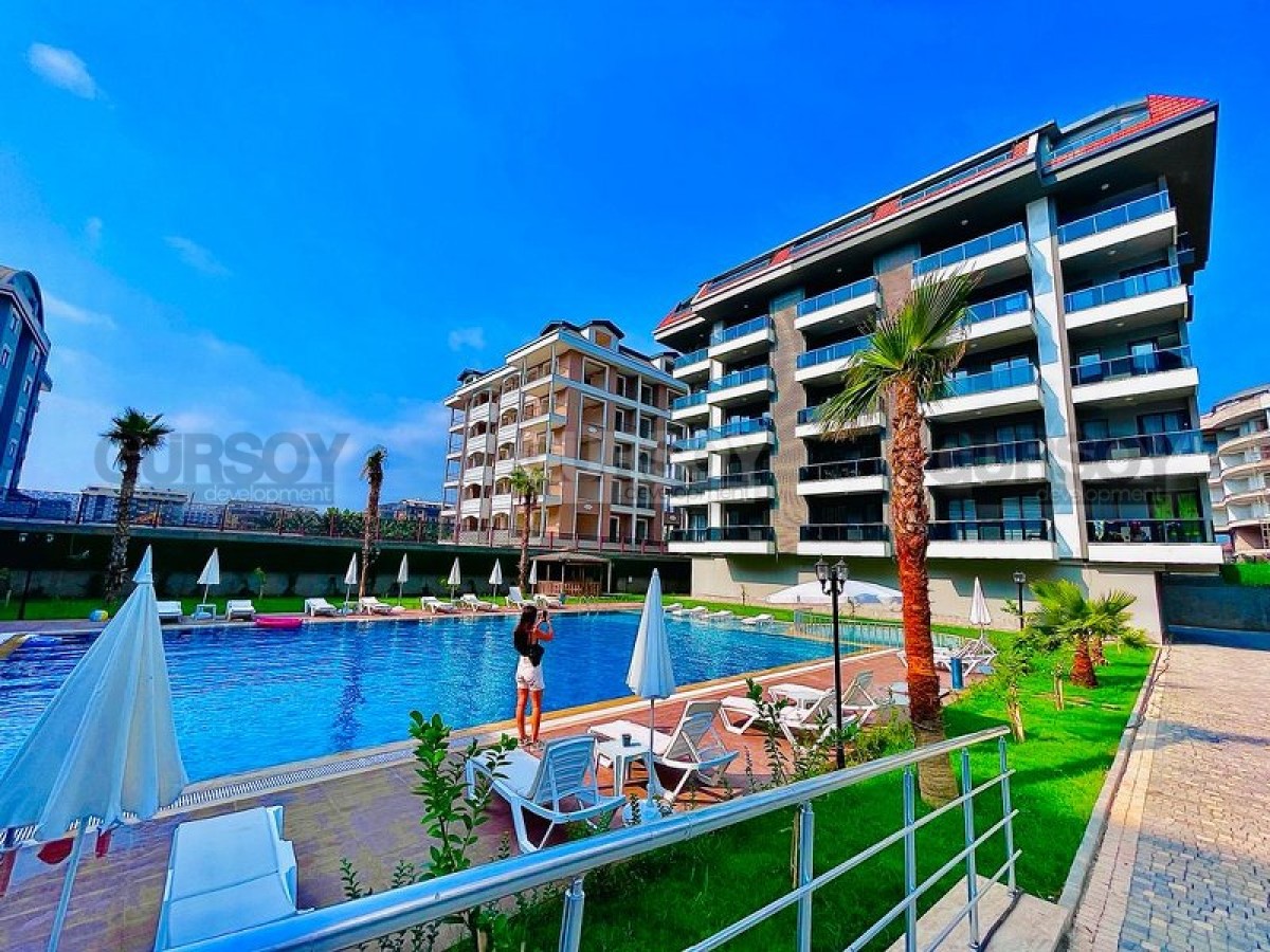 Квартира в современном, комфортабельном жилом комплексе, в 100 метрах от моря, в центре района Каргыджак в Турции - фото 1