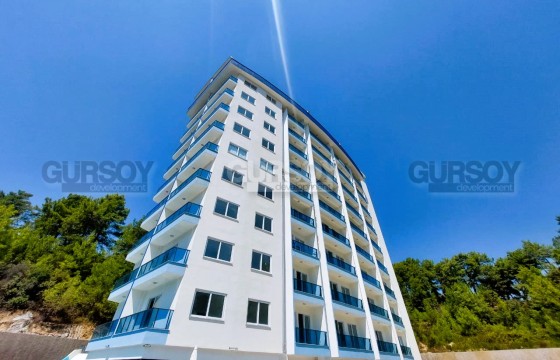 Недорогая квартира с чистовой отделкой, в полутора километрах от моря, в районе Авсаллар в Турции - фото 3