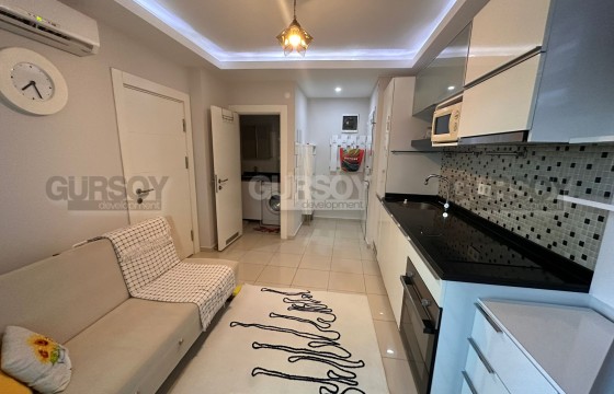 Компактная квартира с современным дизайном, в 400 метрах от моря, в центре района Нижняя Оба в Турции - фото 1