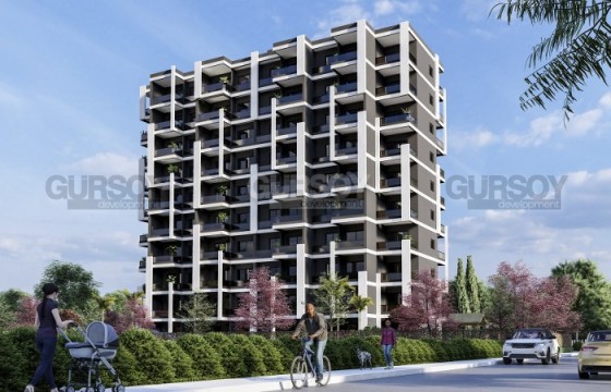 Студии и квартиры 1+1 в жилом комплексе на этапе строительства в популярном районе Мерсина  Арпачбахшиш в Турции - фото 4