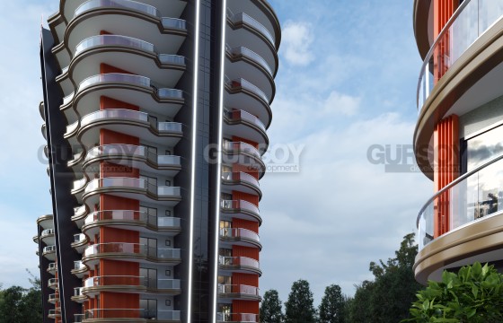 Линейные и двухуровневые апартаменты в жилом комплексе на этапе строительства в 500 метрах от моря, в центре района Махмутлар в Турции - фото 3