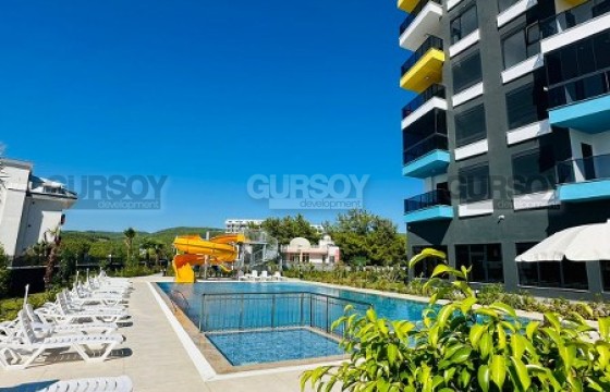 Недорогая двухкомнатная квартира в новом комплексе в районе Авсаллар в Турции - фото 9