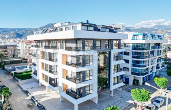 Небольшая резиденция с разнообразными планировками в районе Оба в Турции - фото 1