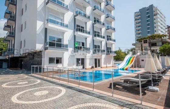 Меблированная квартира планировки 1+1 в новом комплексе, район Махмутлар в Турции - фото 5