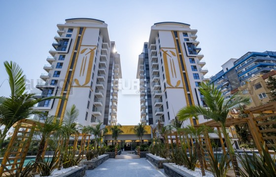 Трехкомнатные апартаменты на первой береговой линии от ведущего застройка в Турции - фото 1