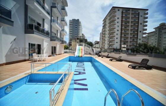 Двухкомнатная квартира в районе Махмутлар по бюджетной цене в Турции - фото 3