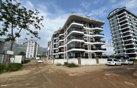 Новая квартира 1+1 в только построенном комплексе в районе Махмутлар в Турции - фото 4